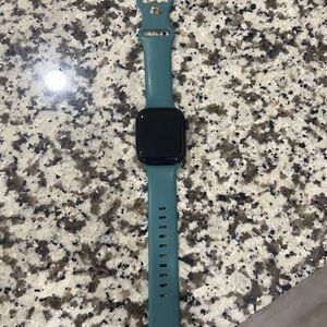 Apple Watch with Teal Silicone Band and Black Case
